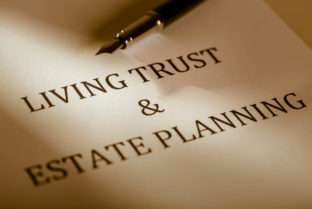 Fountain Pen Lying On The “Living Trust And Estate Planning” – Close Up